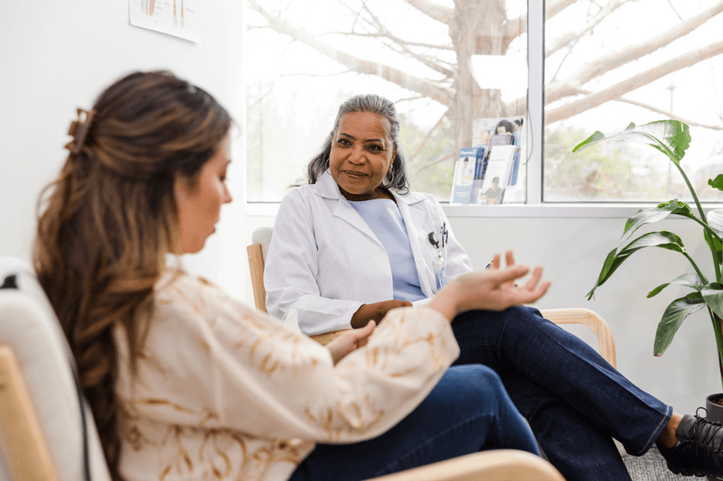 Woman shares issues with post-op recovery with senior female surgeon - stock photo
The mature adult woman gestures as she discusses the issues she has had during her post-operative recovery with the senior adult female surgeon.